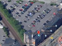 Bag butikken ligger Gåsepigen Parkering